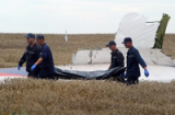 Vụ MH17 rơi: Còn nhiều thi thể nạn nhân vẫn nằm lại hiện trường