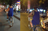 Kỳ lạ người đàn ông quấn trăn vào cổ đạp xe khắp Hà Nội