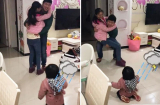 Bố đi công tác bịn rịn ôm mẹ: Phản ứng dễ thương của con gái nhỏ khiến ai cũng phá lên cười