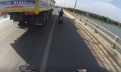 Video: Cô gái mạo hiểm bám theo xe tải để... tránh nắng