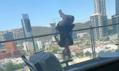Bất chấp trèo lên ban công tầng 6 tập yoga, cô gái gặp họa sau đó