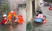 Nước lũ dâng cao lên tận mái nhà, đội cứu hộ bơi vào từng hộ gia đình để giải cứu người dân