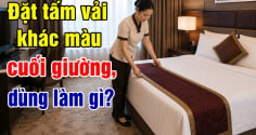 Giường ngủ khách sạn đặt tấm vải khác màu cuối giường, dùng làm gì?