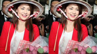 Người đẹp Philippines xinh tươi đội nón lá, ôm hoa sen