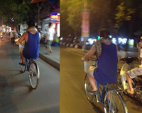 Kỳ lạ người đàn ông quấn trăn vào cổ đạp xe khắp Hà Nội
