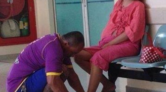 Anh chồng xăm trổ cắt móng chân cho vợ trước phòng khám thai