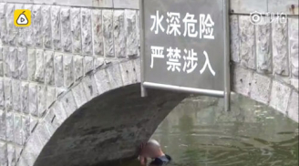 Người đàn ông đau khổ nhảy sông tự tử nhưng chết hụt vì nước chỉ đến ngực