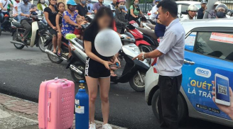 Cô gái xinh đẹp kéo theo cả bình khí cười ra giữa đường Hà Nội để hít xong quỵt tiền taxi