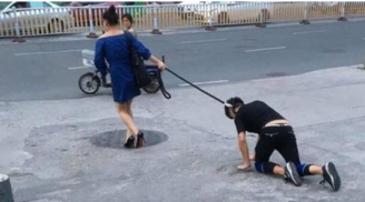 Dậy sóng với bức ảnh cô gái buộc cổ bạn trai dắt như cún giữa đường