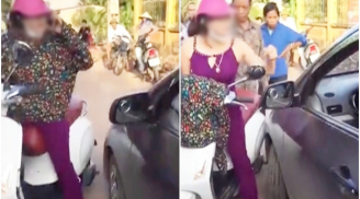 Nữ 'ninja' đứng giữa đường nghe điện thoại, bị ô tô tông liền cởi áo chửi như 'tát nước' rồi đánh nhau