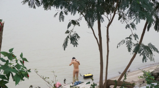 Giữa cái lạnh tê tái ở Hà Nội: Người cuốn chăn ra đường, người vô tư ra bãi giữa sông Hồng tắm tiên