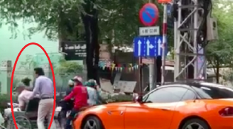 Tài xế BMW bỏ xe giữa phố giúp cụ già sang đường nhưng thái độ của tài xế dừng phía sau mới chú ý