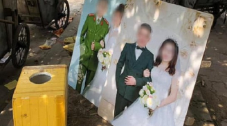 Hai tấm hình cưới bị bỏ lại bên gốc cây ở bãi tập kết rác khiến nhiều người chú ý