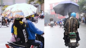 Chính thức quy định 2025: Đi xe máy cầm ô dù có thể bị CSGT phạt tới 14 triệu đồng, có đúng không?